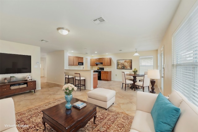 living room featuring light tile patterned flooring