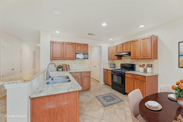 kitchen with sink, backsplash, kitchen peninsula, light tile patterned floors, and black appliances