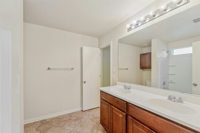 full bathroom featuring shower / bathing tub combination, tile patterned flooring, vanity, and toilet