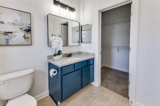 1201 Grove Blvd Unit 1102, Austin, TX 78741 - bathroom with vanity, tile patterned flooring, and a walk in closet