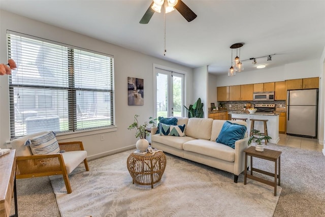 1201 Grove Blvd Unit 1102, Austin, TX 78741 - living room with a ceiling fan and light carpet