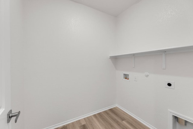 laundry room featuring laundry area, hookup for a washing machine, gas dryer hookup, light wood-type flooring, and hookup for an electric dryer