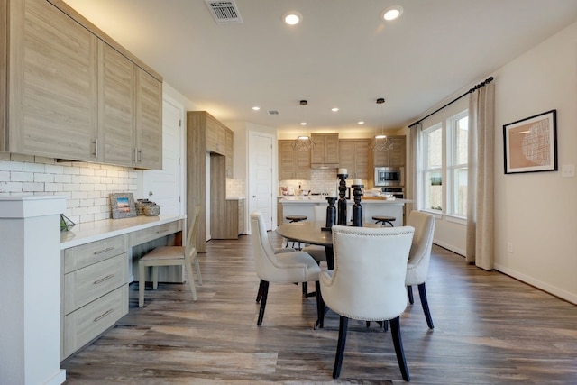 dining space featuring dark hardwood / wood-style floors