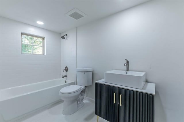 full bathroom featuring vanity, toilet, and tiled shower / bath