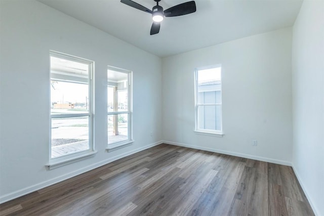 unfurnished room with hardwood / wood-style floors, plenty of natural light, and ceiling fan