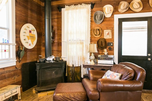 sitting room featuring wooden walls