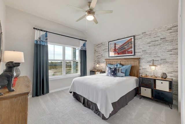 bedroom featuring ceiling fan, lofted ceiling, and light carpet