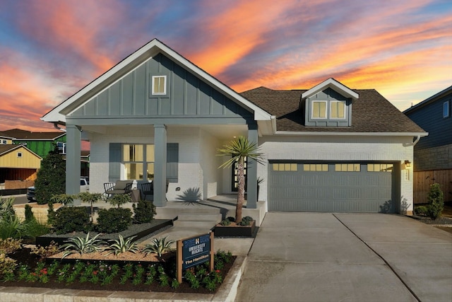 view of front of home with a garage and covered porch