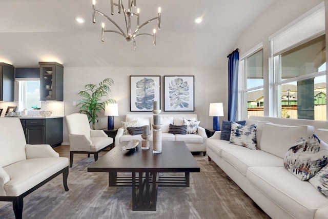 living room with a chandelier and dark hardwood / wood-style floors