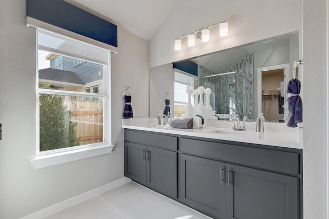 bathroom with tile patterned floors, vanity, vaulted ceiling, and a shower with door