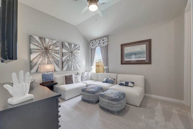 living room featuring ceiling fan, light colored carpet, and vaulted ceiling