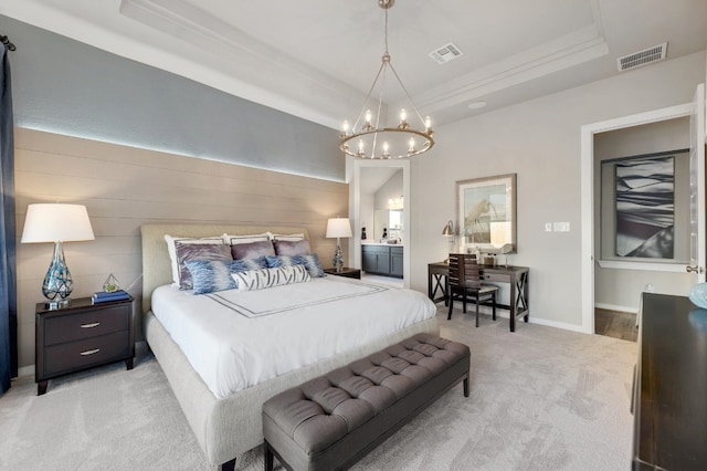 carpeted bedroom featuring an inviting chandelier and a raised ceiling