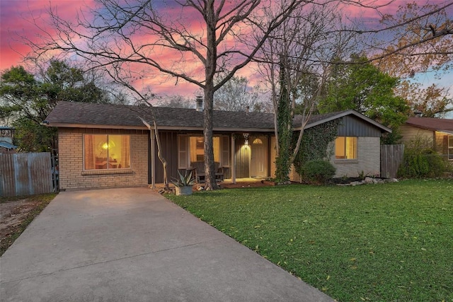 ranch-style house featuring a yard