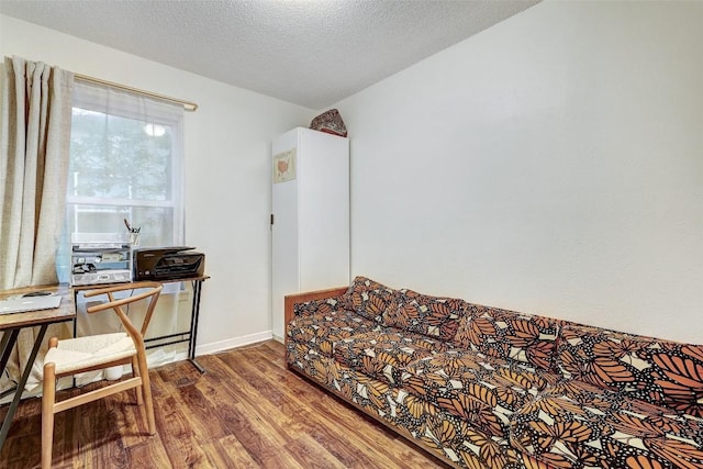 office space featuring hardwood / wood-style floors and a textured ceiling