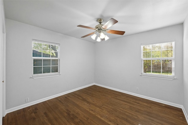 unfurnished room featuring ceiling fan and dark wood-type flooring