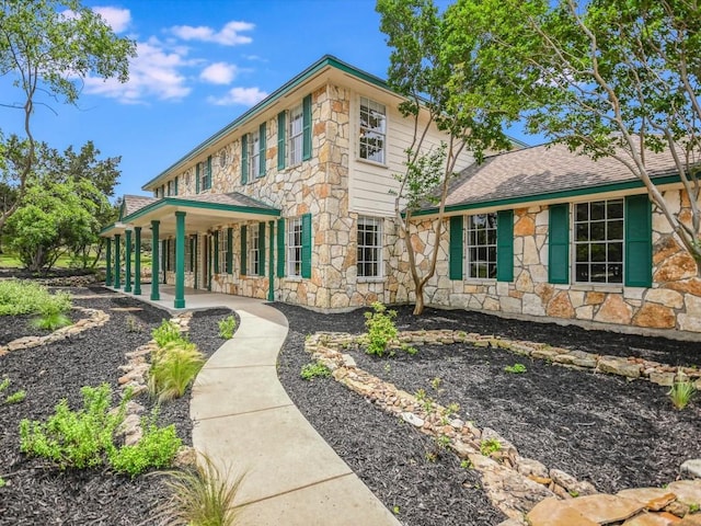 rear view of property with a porch