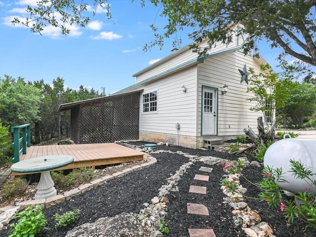 rear view of property with a deck