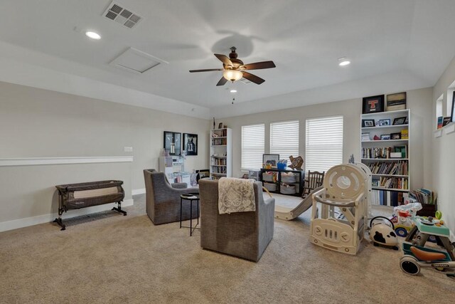 living room featuring light carpet and ceiling fan