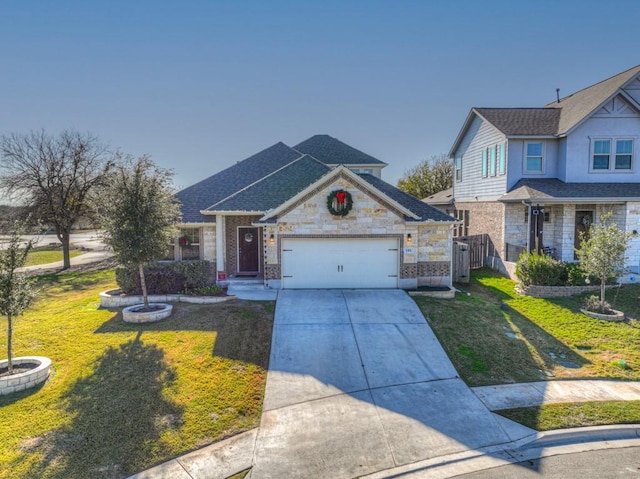 view of front of house featuring a garage, stone siding, driveway, and a front yard