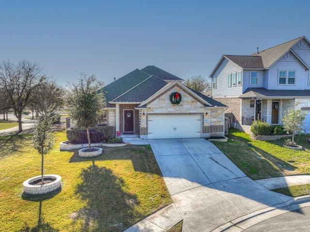 view of front of property featuring a front yard and a garage