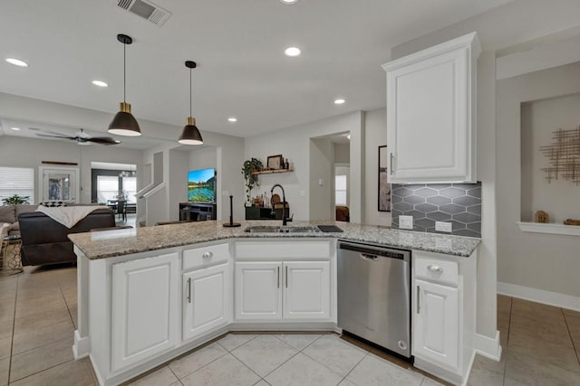 kitchen with white cabinetry, sink, ceiling fan, and stainless steel dishwasher