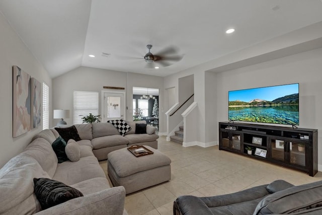 tiled living room featuring ceiling fan and vaulted ceiling