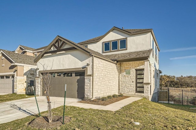 view of front facade featuring a garage and a front lawn