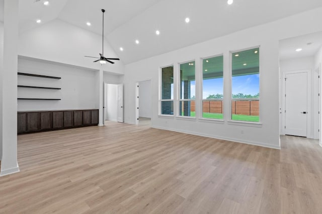 2120 Tobiano Trce, Georgetown, TX 78633 - unfurnished living room featuring ceiling fan, high vaulted ceiling, light wood-style flooring, and recessed lighting