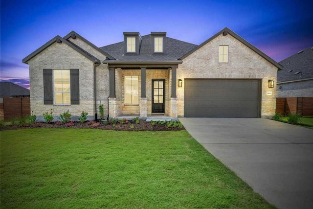 2120 Tobiano Trce, Georgetown, TX 78633 - view of front of house featuring concrete driveway, a garage, brick siding, and roof with shingles