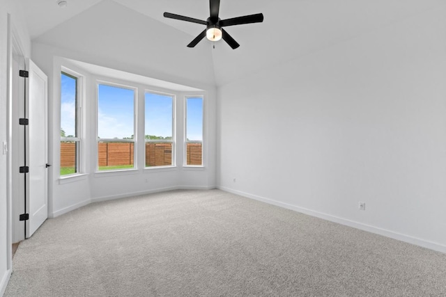 2120 Tobiano Trce, Georgetown, TX 78633 - empty room with light colored carpet, a ceiling fan, baseboards, and lofted ceiling