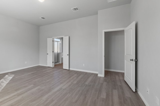 unfurnished bedroom featuring light wood-type flooring