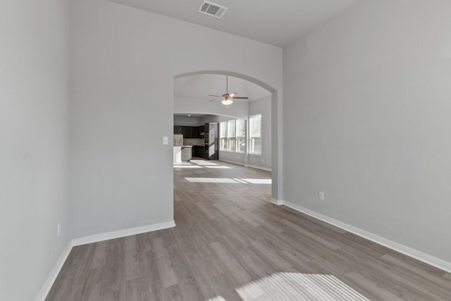 unfurnished room featuring ceiling fan and light hardwood / wood-style flooring