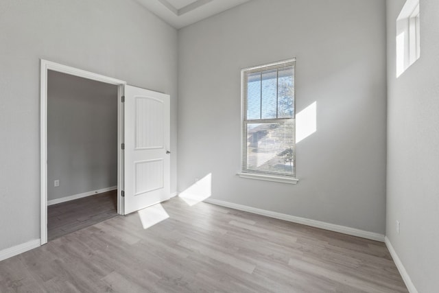 unfurnished room with light hardwood / wood-style flooring