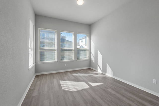 spare room with light hardwood / wood-style flooring