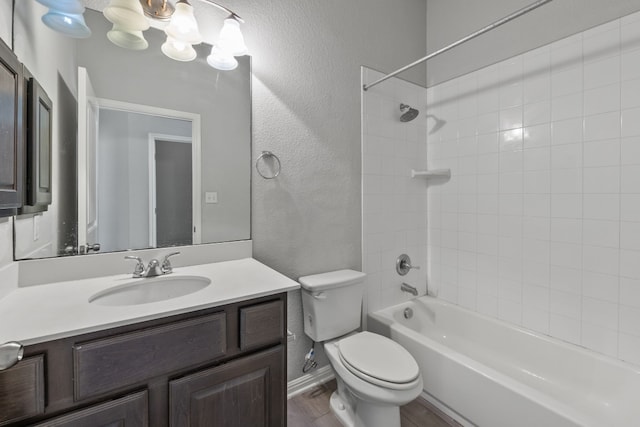 full bathroom featuring shower / bathing tub combination, vanity, hardwood / wood-style flooring, and toilet