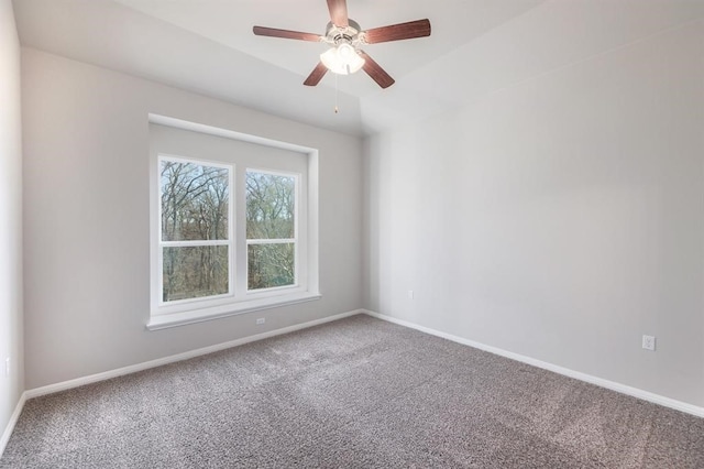 empty room featuring ceiling fan and carpet floors