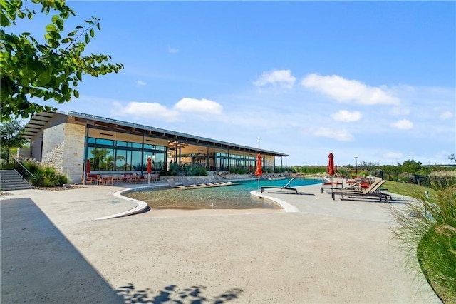 view of pool featuring a patio area