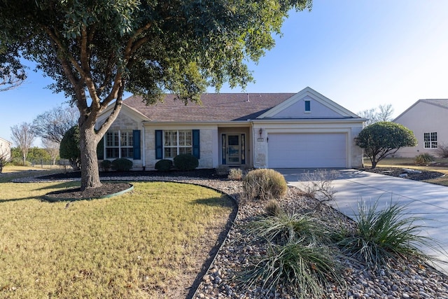 ranch-style house featuring a front yard and a garage