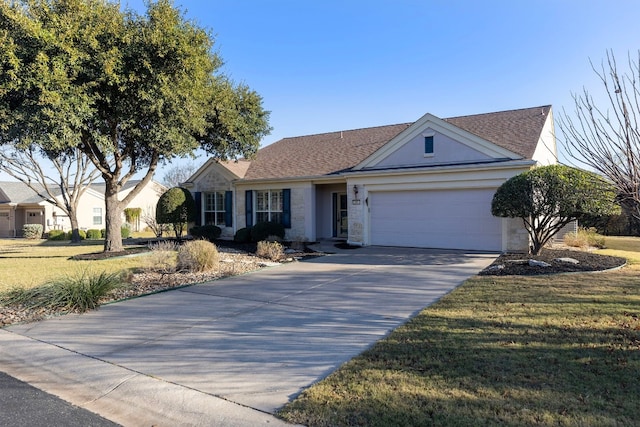 ranch-style home featuring a garage and a front lawn