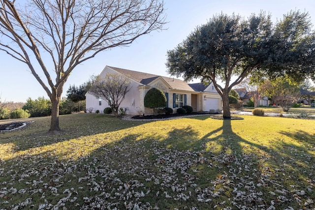 single story home featuring a front lawn and a garage