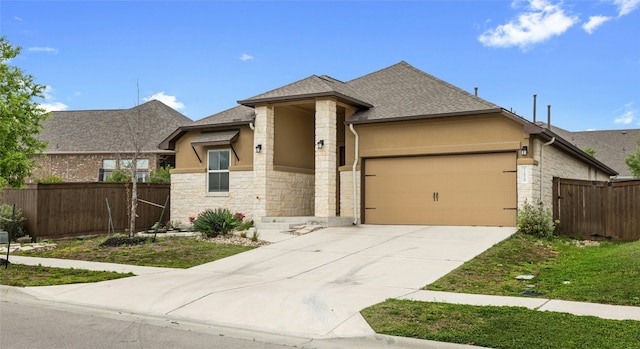 prairie-style home featuring a garage