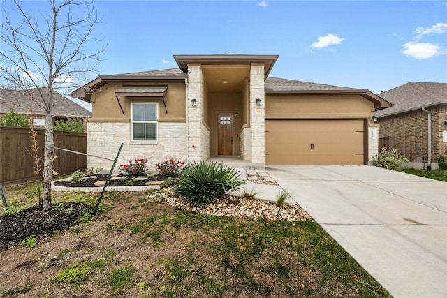 prairie-style home featuring a garage