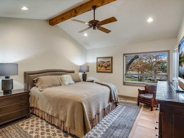 bedroom featuring vaulted ceiling with beams, ceiling fan, and light hardwood / wood-style floors