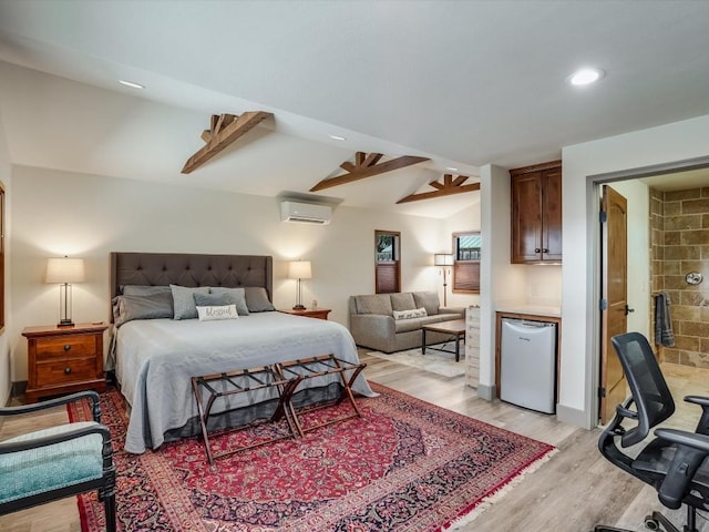 bedroom featuring refrigerator, ensuite bath, a wall unit AC, ceiling fan, and lofted ceiling with beams