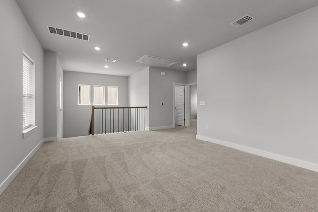 6304 Rotunda Vw, Austin, TX 78747 - spare room with attic access, recessed lighting, and light carpet
