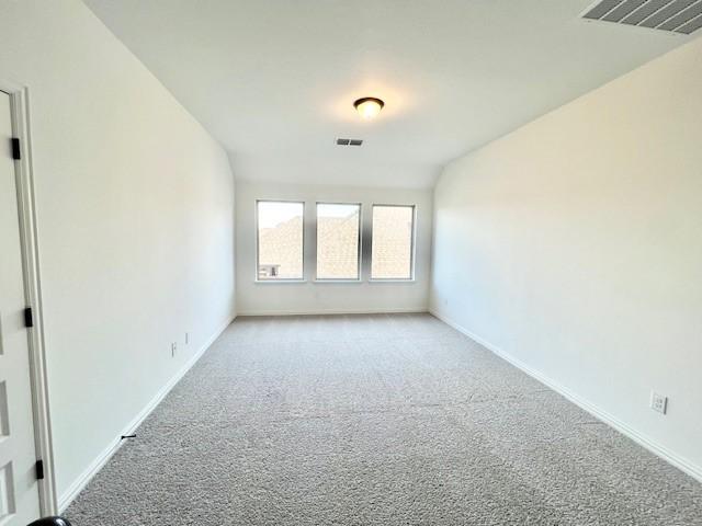 unfurnished room with light colored carpet