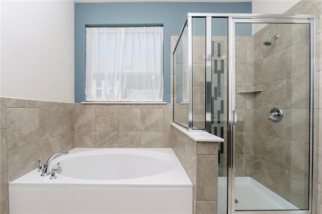 bathroom with separate shower and tub