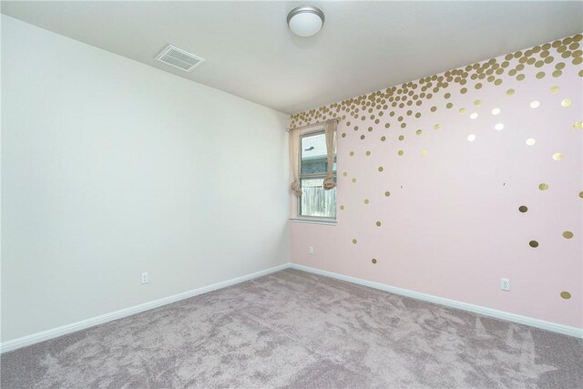 spare room with light colored carpet