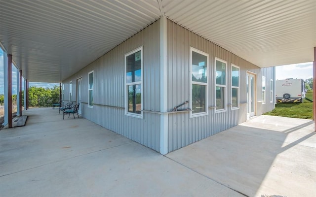 view of side of property featuring a patio