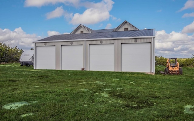 garage featuring a yard